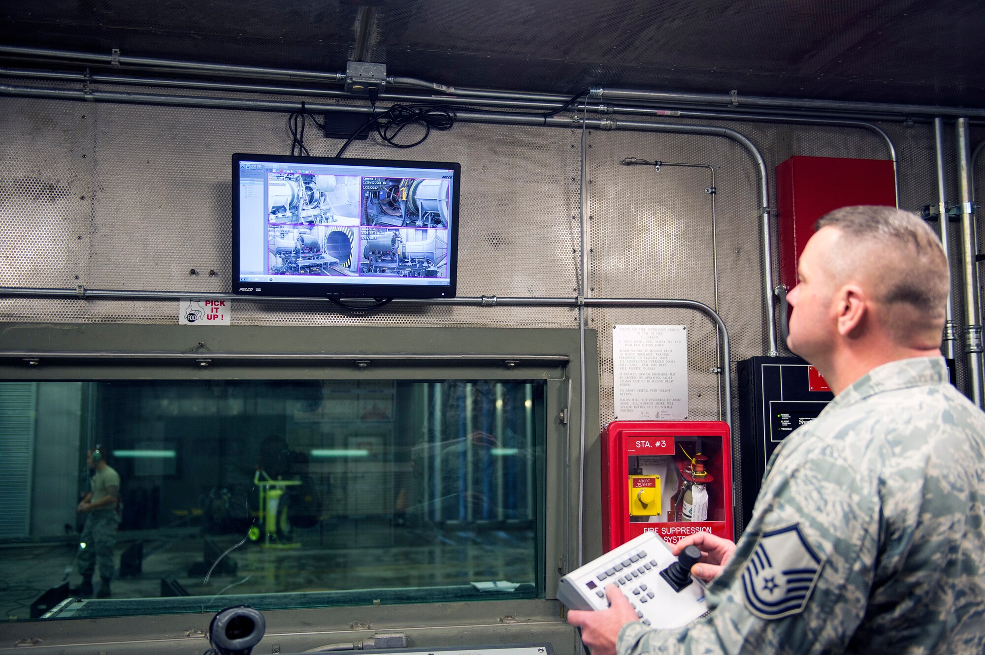 Master Sgt. Thomas Dobbelaere, 23d Component Maintenance Squadron test cell section chief, navigates the new camera system in the newly upgraded “Hush House 1,” Jan. 23, 2017, at Moody Air Force Base, Ga. The facility belongs to the 23d CMS test cell team. They are responsible for testing the TF-34 engine in an enclosed environment that suppresses the sound of engines while they are tested for serviceability. (U.S. Air Force photo by Airman 1st Class Greg Nash)   