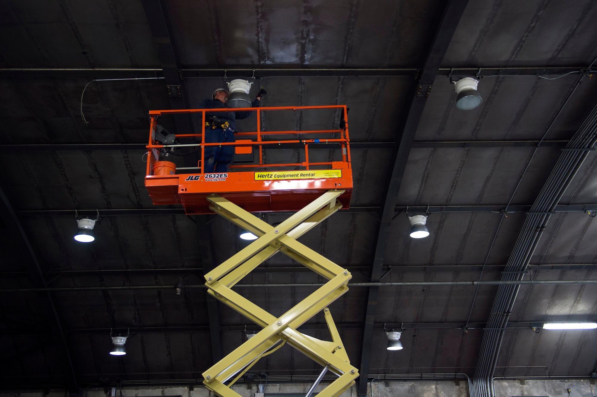 Mark Butler, local civilian contractor, installs a light fixture in the under construction “Hush House 2,” Jan. 23, 2017, at Moody Air Force Base, Ga. All services for the complete overhaul of the facility including the structure, intake and exhaust systems and test systems is slated to finish by approximately April 2017. (U.S. Air Force photo by Airman 1st Class Greg Nash)   