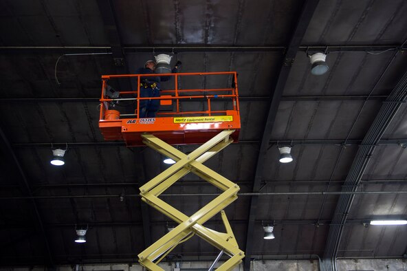 Mark Butler, local civilian contractor, installs a light fixture in the under construction “Hush House 2,” Jan. 23, 2017, at Moody Air Force Base, Ga. All services for the complete overhaul of the facility including the structure, intake and exhaust systems and test systems is slated to finish by approximately April 2017. (U.S. Air Force photo by Airman 1st Class Greg Nash)   