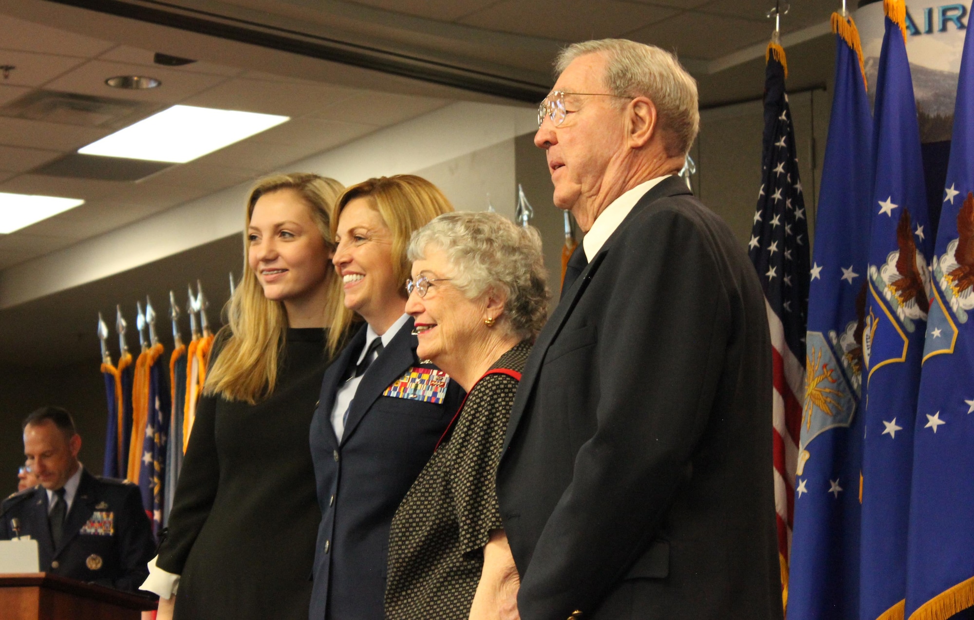 Brig. Gen. Ellen Moore (center), Commander, Air Reserve Personnel Center, stands with her daughter, Maggie, and her parents Sheila and Charley Pritchett during her promotion ceremony Jan. 27, 2017, at Buckley Air Force Base, Colo. Moore is the first female brigadier general to command ARPC. (U.S. Air Force photo by Master Sgt. Beth Anschutz)