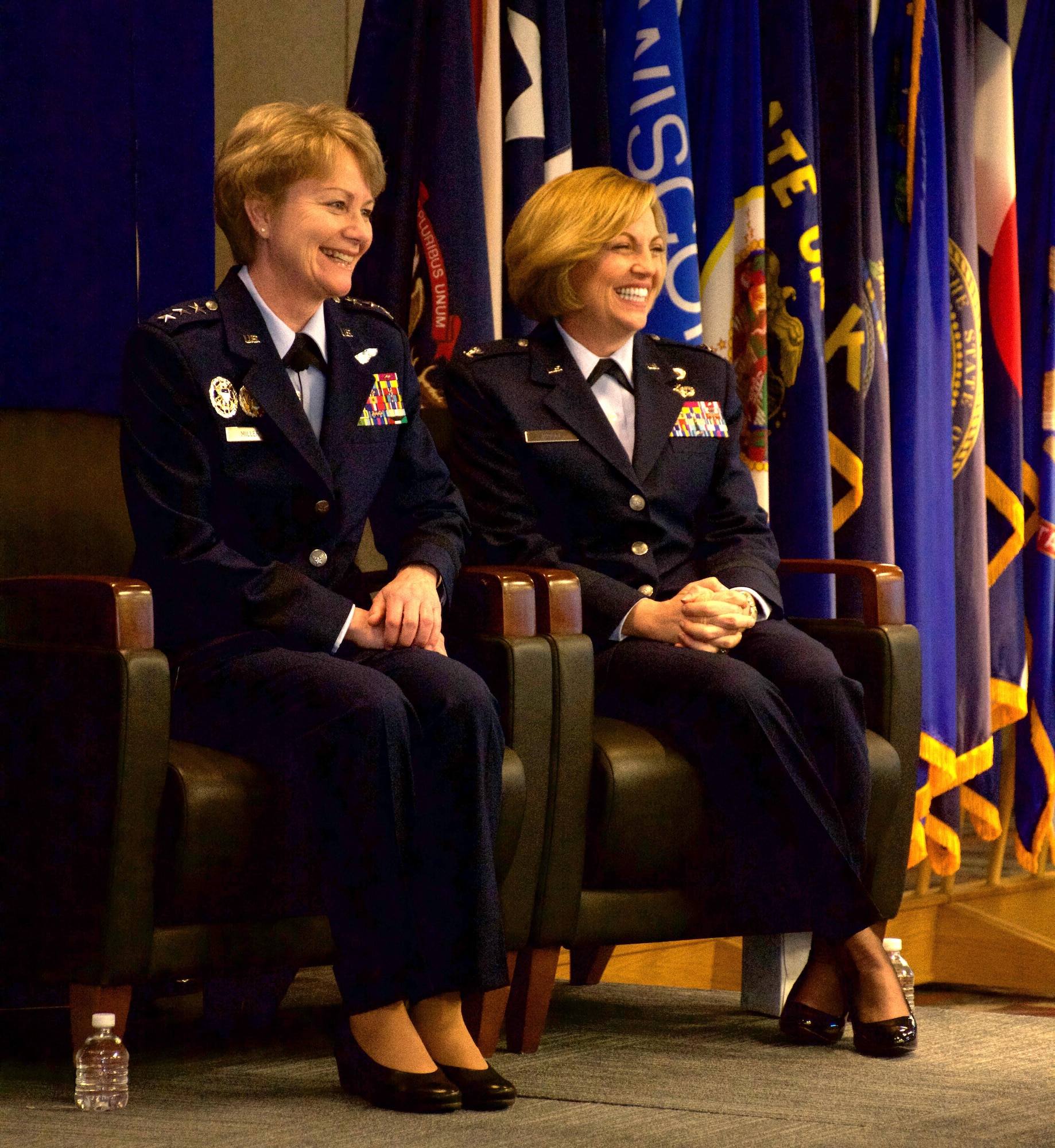 Lt. Gen. Maryanne Miller (left), Chief of Air Force Reserve and Commander, Air Force Reserve Command, and Brig. Gen. Ellen Moore (right), Commander, Air Reserve Personnel Center, smile during Moore's promotion ceremony Jan. 27, 2017, at Buckley Air Force Base, Colo. Moore is the first female brigadier general of ARPC. (U.S. Air Force photo by Master Sgt. Rick Grybos)
