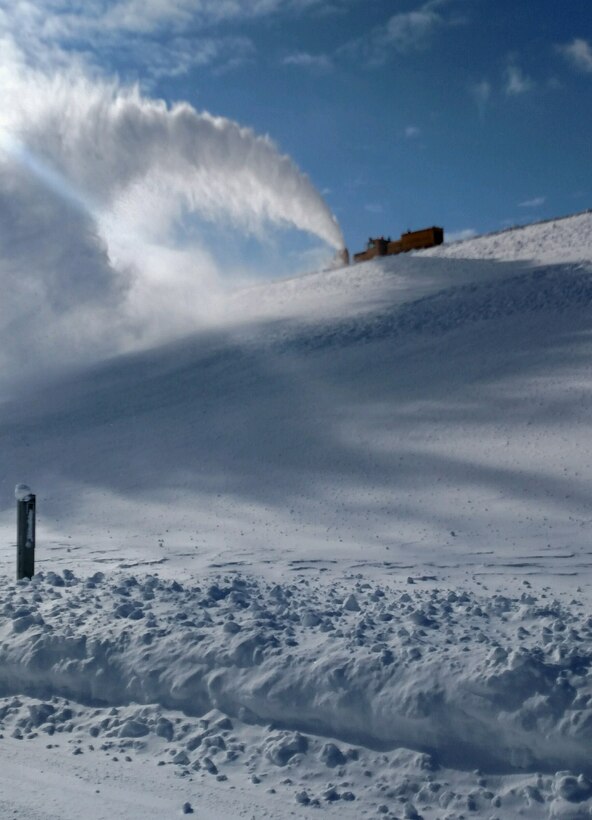 The big Oshkosh, driven by Corps Employee Chris Olson does its job blowing snow in an effort in cleaning up Crest Road. 