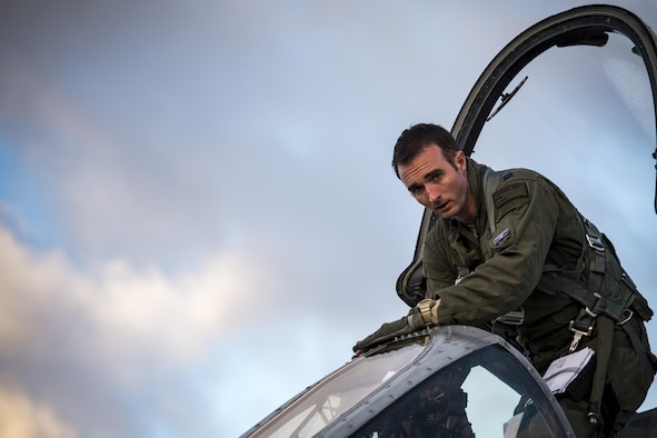 Capt. Eric Laprade, 74th Fighter Squadron A-10C Thunderbolt II pilot, looks up while climbing into the cockpit prior to a sortie at Green Flag-West 17-03, Jan. 24, 2017, at Nellis Air Force Base, Nev. The 74th FS brought 12 A-10s to GFW in support of a joint, large-force combat-readiness exercise for close air support integration training. (U.S. Air Force photo by Staff Sgt. Ryan Callaghan