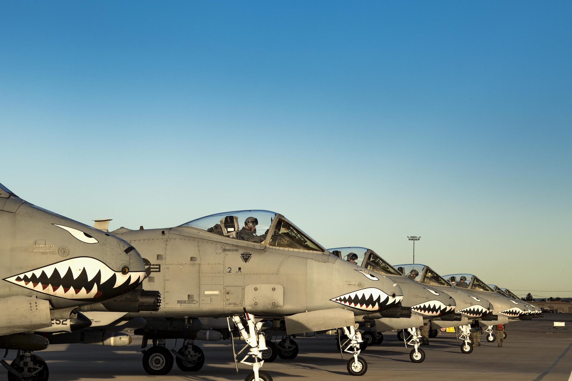 Seven A-10C Thunderbolt II aircraft from the 74th Fighter Squadron line up at the end of the runway for final preparations before take off during Green Flag-West 17-03, Jan. 24, 2017, at Nellis Air Force Base, Nev. The 74th FS brought 12 A-10s to GFW in support of a joint, large-force combat-readiness exercise for close air support integration training. (U.S. Air Force photo by Staff Sgt. Ryan Callaghan)