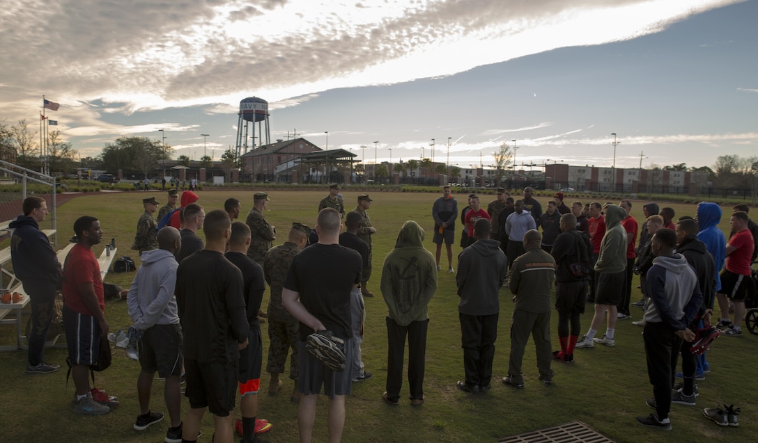 Sgt. Maj. Michael J. Rowan (middle), sergeant major of headquarters battalion, talks to Marines prior to the commencing of the Marine Corps Support Facility New Orleans Super Bowl tournament, Jan. 27, 2017. The tournament was held to build camaraderie, unit cohesion and esprit de corps between all departments within MARFORRES Headquarters. (U.S. Marine Corps photo by Lance Cpl. Dallas Johnson/Released)