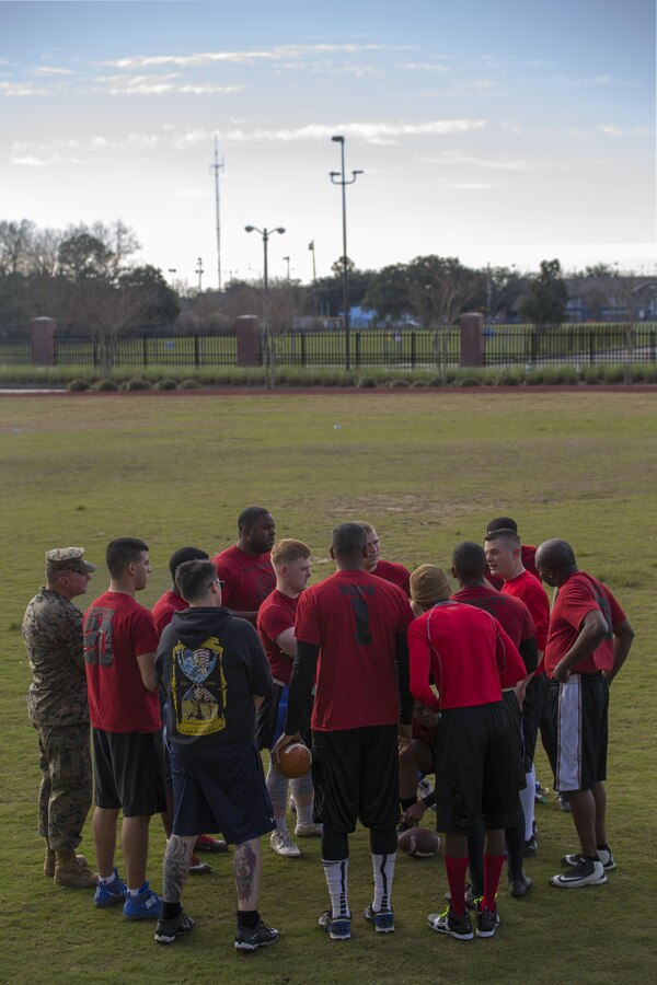 Marines with Marine Forces Reserve go over their game plan before competing in the Marine Corps Support Facility New Orleans Super Bowl tournament, Jan. 27, 2017. The tournament was held to build camaraderie, unit cohesion and esprit de corps between all departments within MARFORRES Headquarters. (U.S. Marine Corps photo by Lance Cpl. Dallas Johnson/Released)