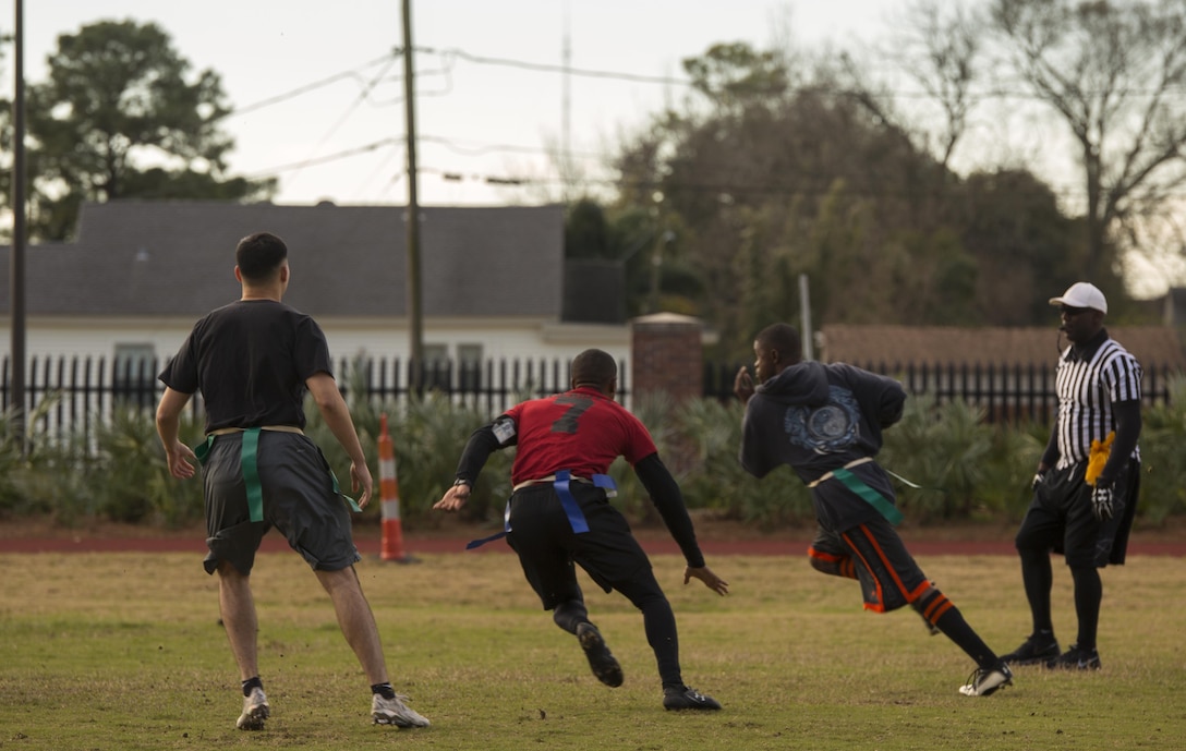 Marines with Marine Forces play football during the Marine Corps Support Facility New Orleans Super Bowl tournament, Jan. 27, 2017. The tournament was held to build camaraderie, unit cohesion and esprit de corps between all departments within MARFORRES Headquarters. (U.S. Marine Corps photo by Lance Cpl. Dallas Johnson/Released)