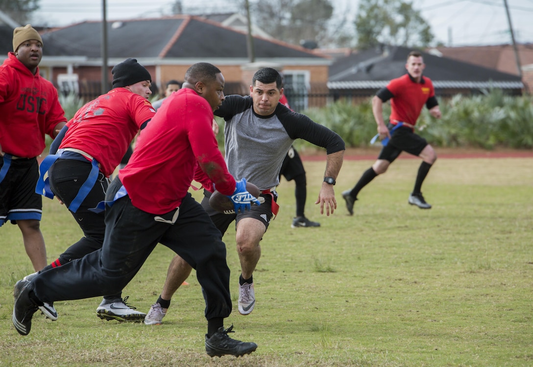 Master Sgt. Jeffrey J. Clay, training manager, Marine Forces North, runs for a touchdown during the Marine Corps Support Facility New Orleans Super Bowl tournament, Jan. 27, 2017. The tournament was held to build camaraderie, unit cohesion and esprit de corps between all departments within MARFORRES Headquarters. (U.S. Marine Corps photo by Lance Cpl. Dallas Johnson/Released)
