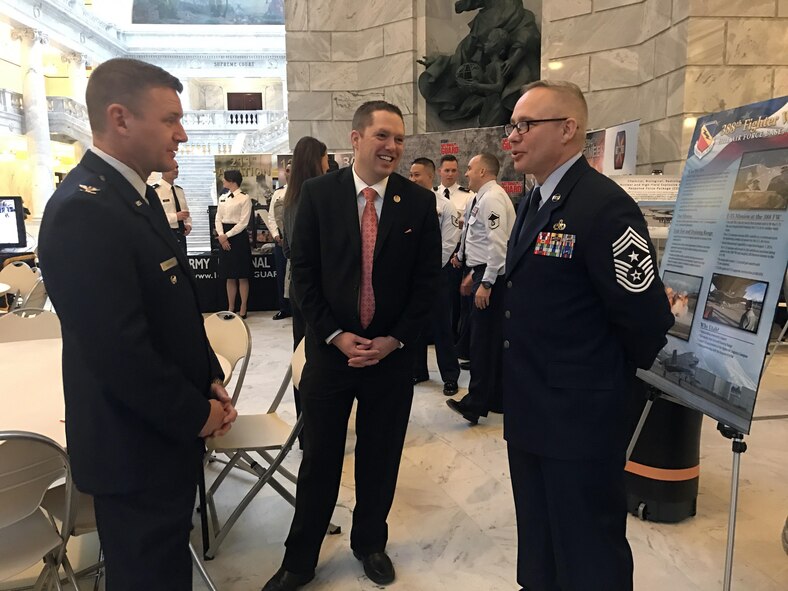 Staff Sgt. Bruce Gjetley (left), 388th Operations Support Squadron, explains the finer points of the F-35A helmet to Utah State Senator Ann Millner and Chief Master Sgt. Don Stroud, 388th Fighter Wing command chief, June 26 at the Utah State Capitol Rotunda during the Utah Defense Alliance ‘Meet the Military’ event with the Utah legislature. (U.S. Air Force photo by Donovan Potter)