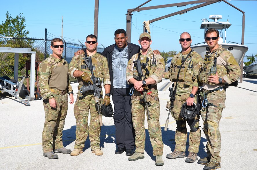NFL football hero Herschel Walker visited Patrick Air Force Base, January 24, taking  time to meet with Guardian Angel Airmen from the 920th Rescue Wing. These elite warrior Airmen undergo intense physical and mental training to rescue isolated personnel in combat. They toured Walker through their squadron and demonstrated some of their rescue skills. Throughout the visit, Walker held their rapt attention sharing lots of inspirational accounts of his days playing football. Later that afternoon, Walker stood in front of several hundred Patrick AFB employees who came to listen to his personal battled with mental illness. (U.S. Air Force photo/Maj. Cathleen Snow)
