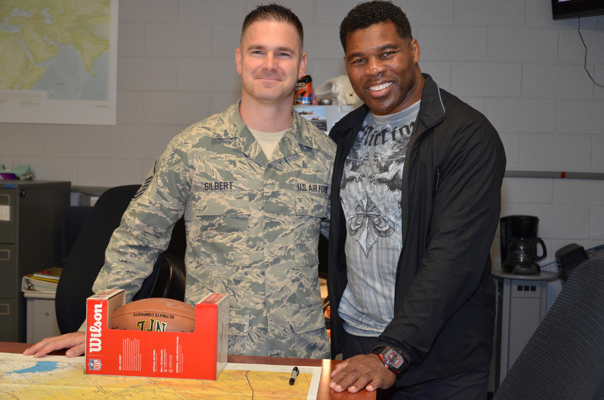 NFL football hero Herschel Walker visited Patrick Air Force Base, January 24, taking  time to meet with Guardian Angel Airmen from the 920th Rescue Wing. These elite warrior Airmen undergo intense physical and mental training to rescue isolated personnel in combat. They toured Walker through their squadron and demonstrated some of their rescue skills. Throughout the visit, Walker held their rapt attention sharing lots of inspirational accounts of his days playing football. Later that afternoon, Walker stood in front of several hundred Patrick AFB employees who came to listen to his personal battled with mental illness. (U.S. Air Force photo/Maj. Cathleen Snow)
