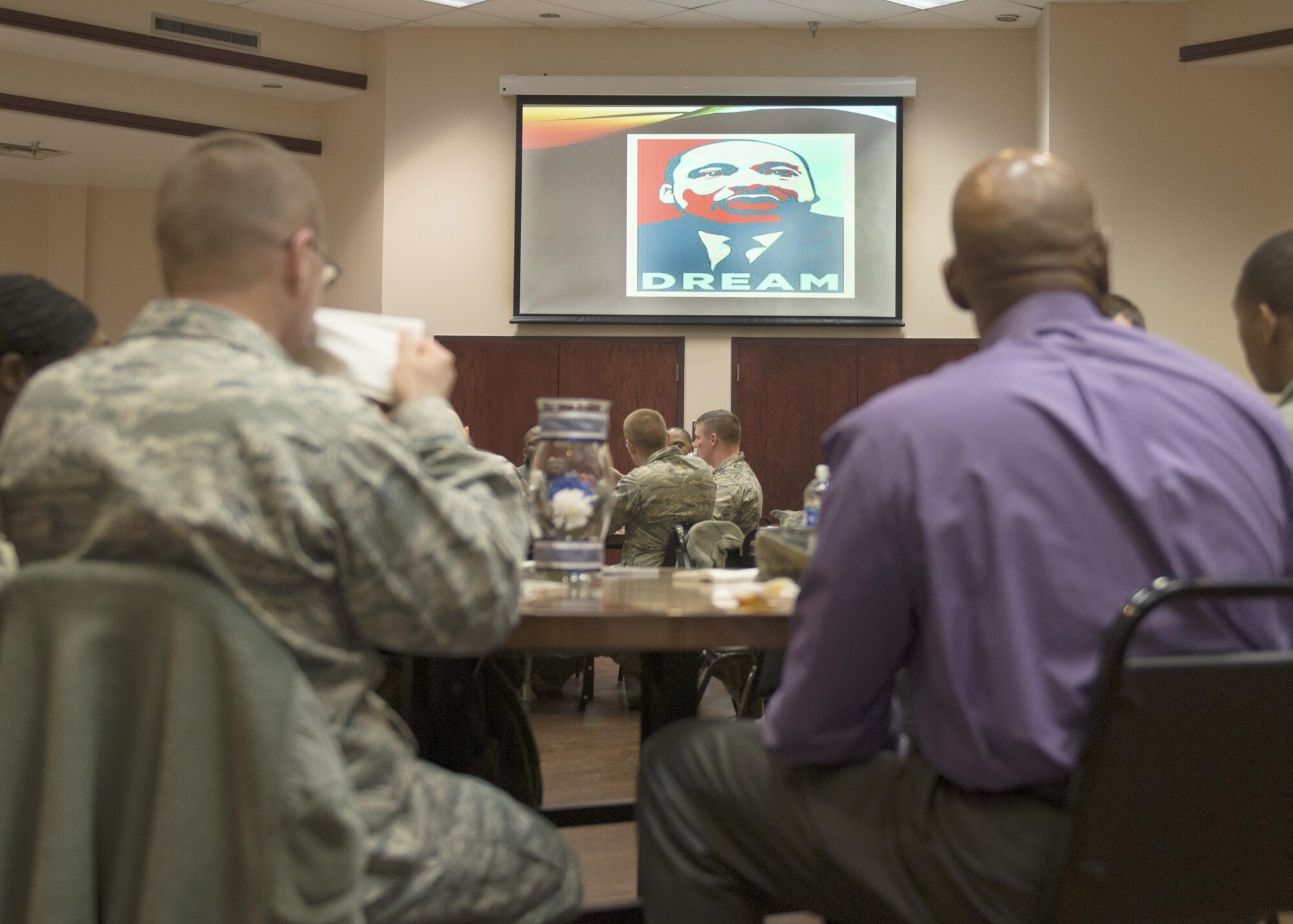 Members of Altus Air Force Base gather for an observance luncheon to celebrate Dr. Martin Luther King Jr., Jan. 27, 2017, at Altus AFB, Oklahoma. The luncheon showcased Airmen performing skits reenacting events from peaceful Civil Rights protests. (U.S. Air Force photo by Airman Jackson N. Haddon/ Released)