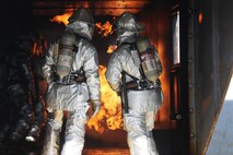 Cpl. Noah Rios Cpl. Caden Vanbuskirk monitor the other rescuemen to ensure they are safe and conducting the training properly during a live fire training event on Marine Corps Air Station New River, N.C., Jan. 19, 2017. While doing training, the Marines keep enough water with them for the training and for an emergency. Rios and Vanbuskirk are rescuemen with Marine Corps Air Station New River’s Aircraft Rescue Firefighting division. (U.S. Marine Corps photo by Cpl. Melodie Snarr)