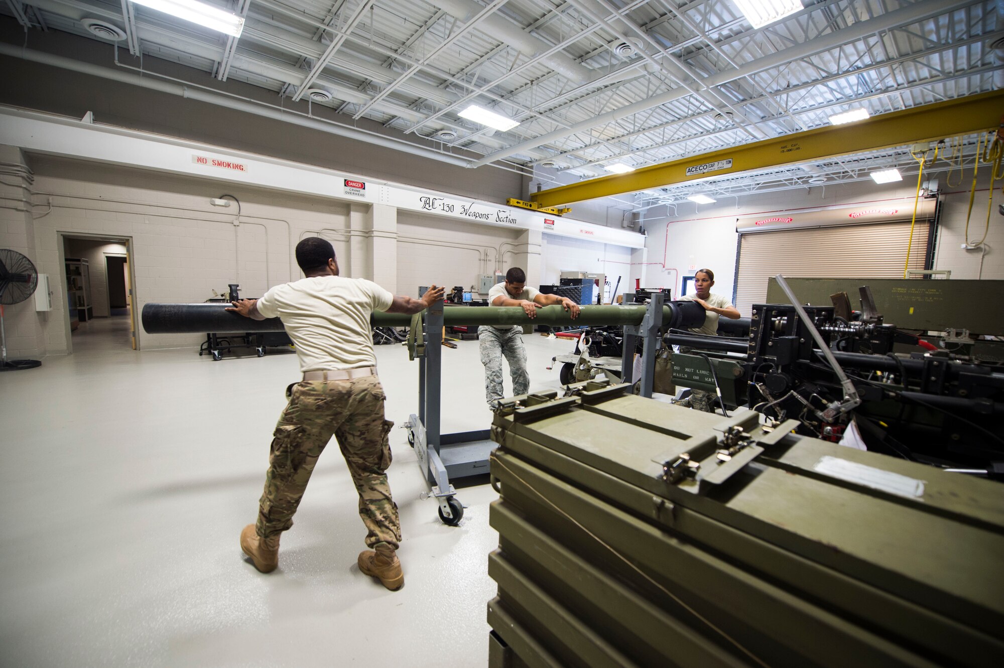 Armament Airmen with the 1st Special Operations Maintenance Squadron work on a 105 mm Howitzer at Hurlburt Field, Fla., Jan. 25, 2017. Armament Airmen with the 1st SOMXS work on AC-130J Ghostrider and AC-130U Spooky gunships’ weapon systems. (U.S. Air Force photo by Senior Airman Krystal M. Garrett)