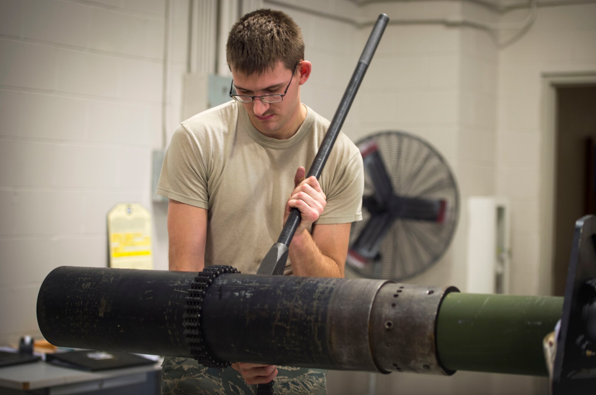 Airman 1st Class Garrett Foret, an armament journeyman with the 1st Special Operations Maintenance Squadron, installs a blast diffuser on a 105 mm Howitzer at Hurlburt Field, Fla., Jan. 25, 2017. Armament Airmen with the 1st SOMXS work on AC-130J Ghostrider and AC-130U Spooky gunships’ weapon systems. (U.S. Air Force photo by Senior Airman Krystal M. Garrett)