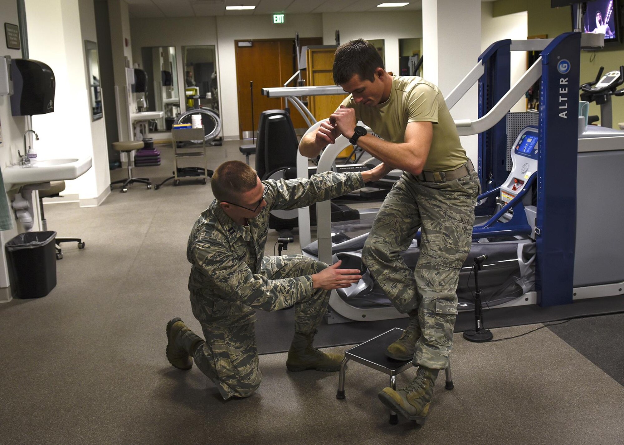 PETERSON AIR FORCE BASE, Colo. – Capt. Jeff Turner, 21st Medical Operations Squadron physical therapist, works through an exercise with Capt. Matt Williams, also a 21st MDOS physical therapist, at the clinic on Peterson Air Force Base, Colo., Jan. 25, 2017. The clinic is part of the Biomedical Sciences Corps and recognized as one of 17 specialty careers during BSC Appreciation Week, Jan. 23-27. (U.S. Air Force photo by Senior Airman Rose Gudex)