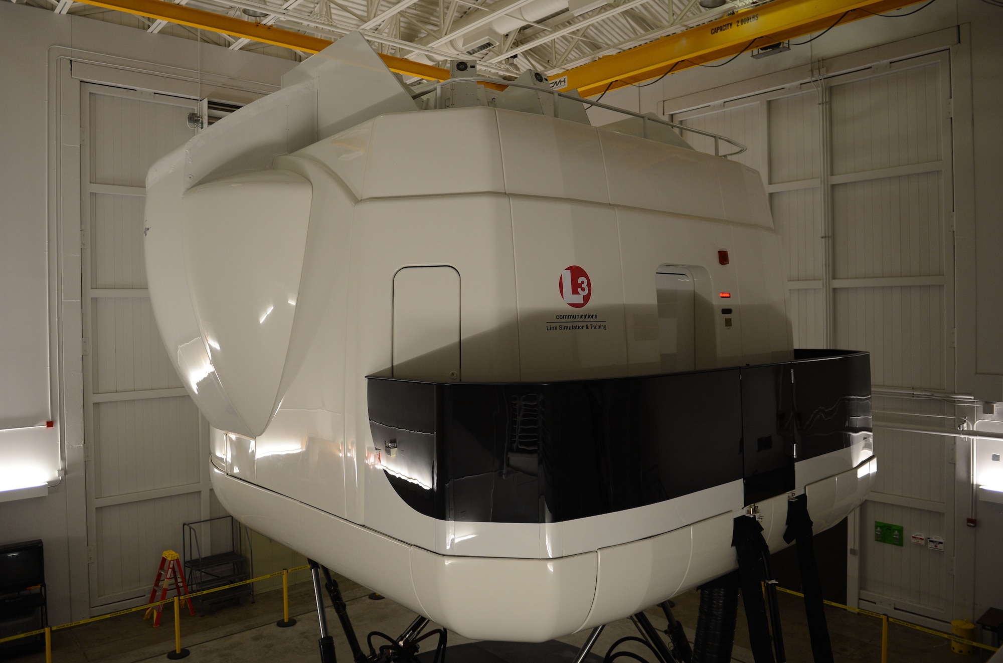 A C-17 Globemaster III flight simulator sits ready for pilots to board before a training Jan. 26, 2017 at Joint Base Lewis-McChord, Wash. McChord C-17 pilots maintain current and ready for any mission at a moment’s notice by conducting regular training throughout the year in the simulator. (U.S. Air Force photo/Senior Airman Divine Cox) 