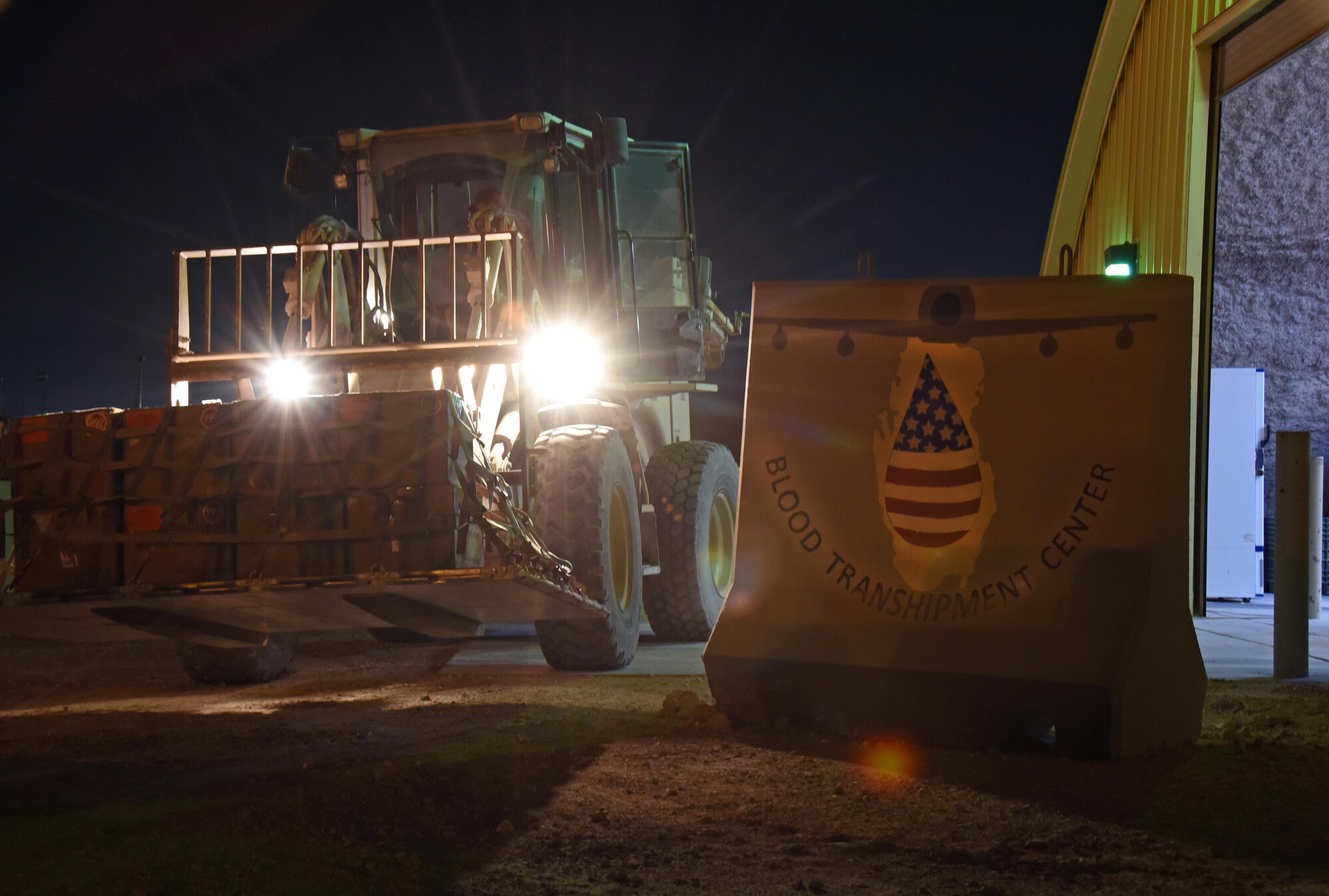 U.S. Air Force Senior Airman Celina Garcia, a medical logistics technician with the 379th Expeditionary Medical Group blood transshipment center, drives a 10K forklift in order to move a pallet of blood units at Al Udeid Air Base, Qatar, Jan. 27, 2017. A selection of Airmen within the blood transshipment center achieve certification to operate material handling equipment in order to expedite the shipping of blood units.  (U.S. Air Force photo by Senior Airman Cynthia A. Innocenti)