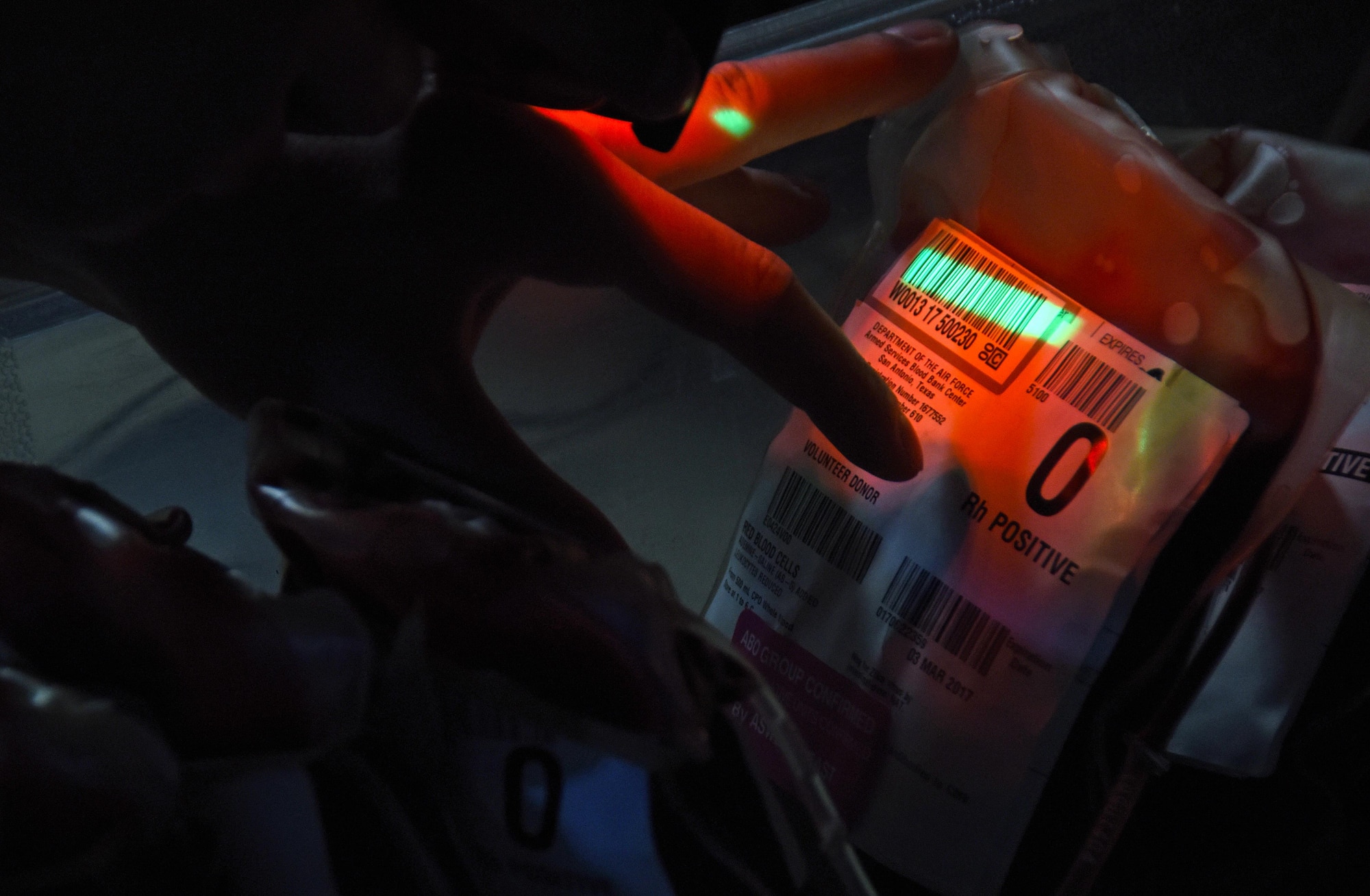 U.S. Air Force Senior Airman Dean Blackmore, a medical laboratory technician with the 379th Expeditionary Medical Group blood transshipment center, scans blood units at Al Udeid Air Base, Qatar, Jan. 27, 2017. Every time the Airmen handle these blood units, they are up against the clock because of the strict temperature guidelines used to keep the units viable. (U.S. Air Force photo by Senior Airman Cynthia A. Innocenti)