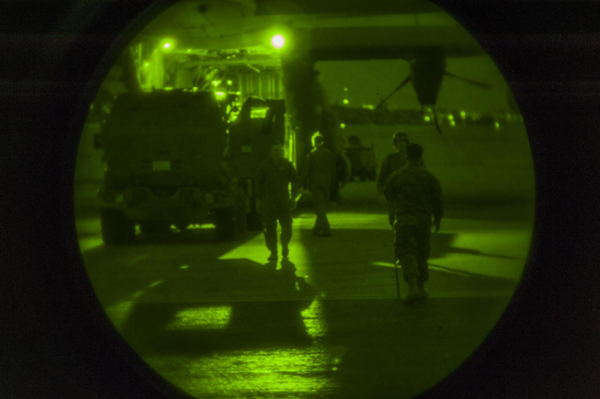 U.S. Marine Corps Marines with the 5th Battalion, 11th Marines, and U.S. Air Force Airmen with the 17th Special Operations Squadron, load a high mobility artillery rocket system onto a C-130 Hercules on the flightline at Kadena Air Base, Japan, Jan. 23, 2017. Marines and Airmen spent a majority of the day loading and unloading the HIMAR system onto a C-130 Hercules for day and nighttime iterations. (U.S. Air Force photo by Airman 1st Class Nick Emerick/Released)