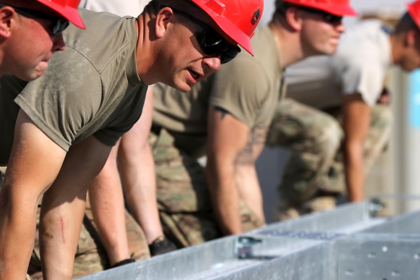Soldiers from the 176th Engineer Brigade of the Texas Army National Guard, also known as Task Force Chaos, build the steel frame of a two-story modular unit Jan. 11, 2017, which will have the capacity to hold 160 individuals with 20 climate controlled rooms on each floor at Camp Redleg in Southwest Asia. This is a U.S. Army Central Command directed project to enhance the quality of life and save millions of dollars in the future with energy cost savings and troop labor.