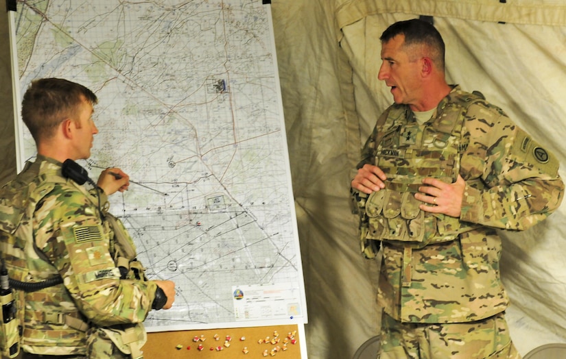 Maj. George Morris, 2nd Squadron, 13th Cavalry Regiment operations and training officer, shows Maj. Gen. William B. Hickman, U.S. Army Central deputy commanding general – operations, training objectives and points of engagement planned during a multinational training exercise occurring at, Udairi range, Kuwait Sept. 26, 2016. (U.S. Army Photos by Sgt. Aaron Ellerman)