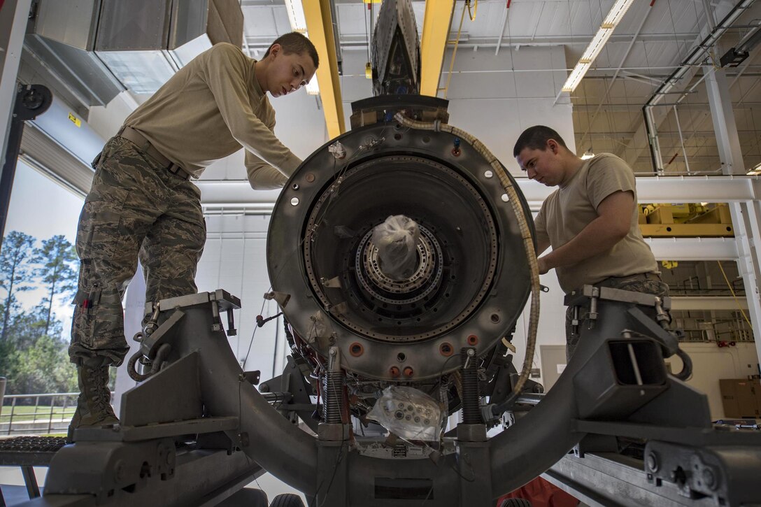 Air Force Airman 1st Class Anthony Guevara, left, and Airman 1st Class Jesse Mendheim disassemble a TF-34 engine used in A-10C Thunderbolt ll aircraft at Moody Air Force Base, Ga., Jan. 25, 2017. Both are propulsion technicians with the 23rd Component Maintenance Squadron. Air Force photo by Airman 1st Class Daniel Snider