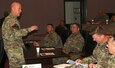 Maj. Gen. John B. Morrison Jr. (left), U.S. Army Cyber Center of Excellence commanding general, speaks with U.S. Army Central staff during a staff visit to the CCoE at Fort Gordon, Georgia Dec. 9.