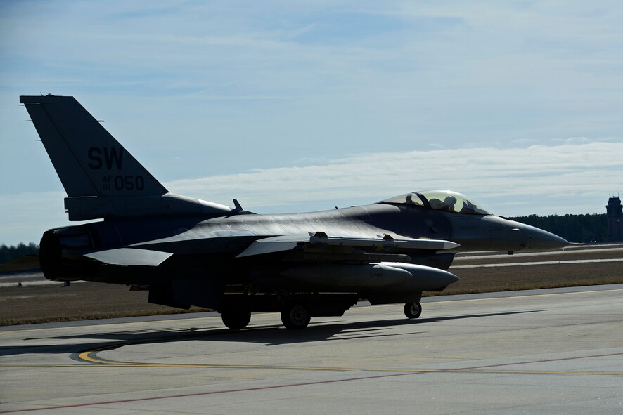 An F-16CM Fighting Falcon prepares for takeoff from Shaw Air Force Base, S.C., Jan. 19, 2017 to Red Flag 17-1 at Nellis AFB, Nev. Red Flag is an exercise that occurs about four times a year and allows multiple aircraft to participate in a realistic training environment. (U.S. Air Force photo by Airman 1st Class BrieAnna Stillman) 

