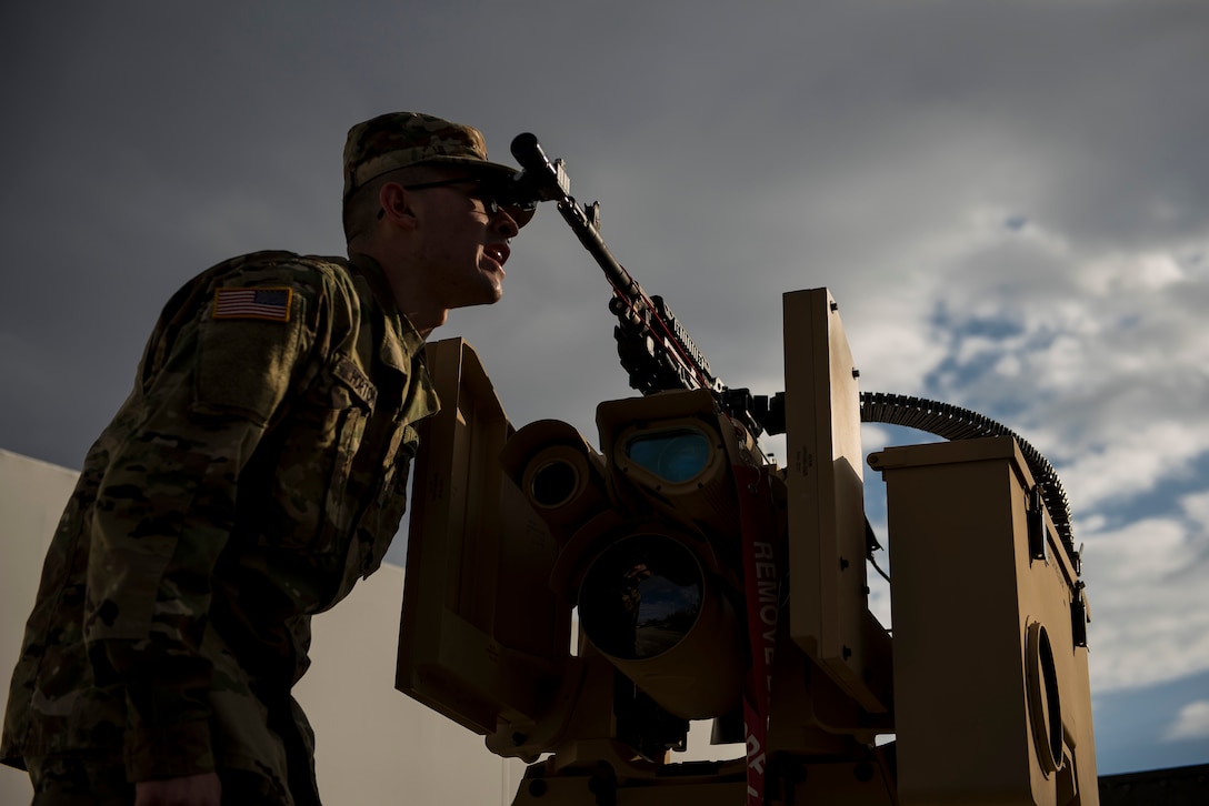 Pfc Seth Horton, U.S. Army Reserve military police Soldier with the 346th Military Police Company, of Wichita, Kansas, performs a boresight alignment on a crew serve weapon mounted to a Common Remotely Operated Weapon Station (CROWS), at Fort Chaffee, Arkansas, Jan. 25. The CROWS is a remote-controlled system compatible with four major crew-serve weapons, and it was developed to keep gunners safe within the vehicle while engaging enemy targets. (U.S. Army Reserve photo by Master Sgt. Michel Sauret)