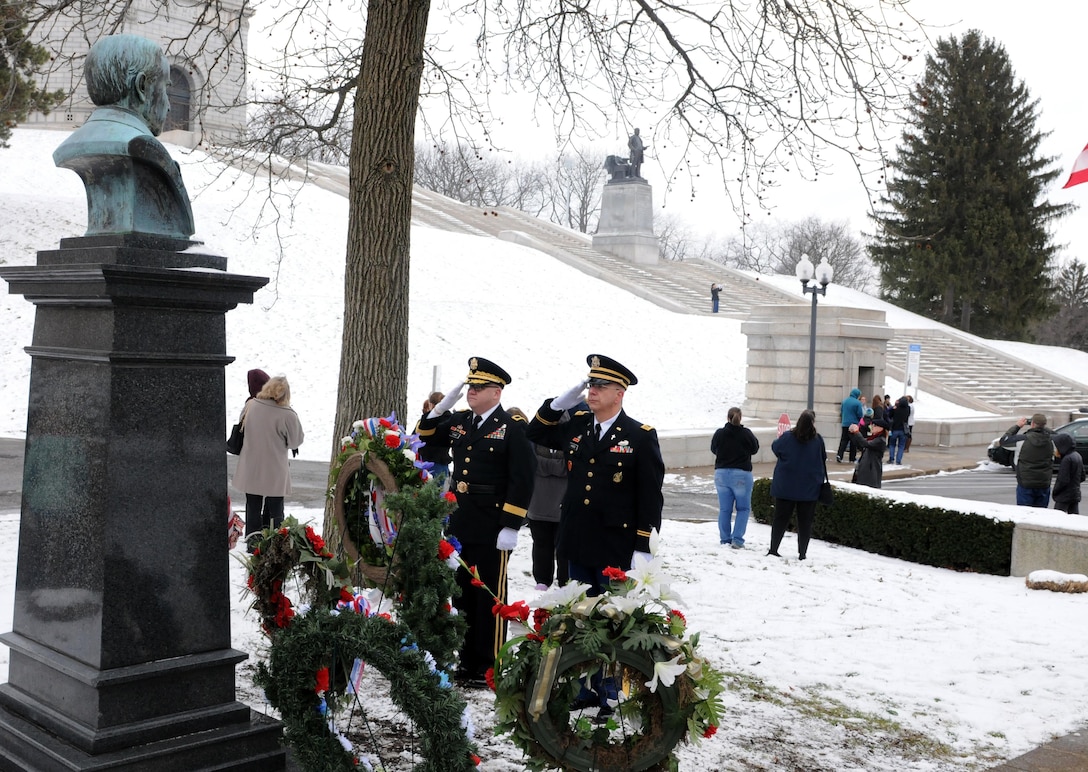 Brigadier Gen. Stephen E. Strand, left, deputy commanding general for the 88th Regional Support Command, and Chaplain (Maj.) Scott Hagen, the deputy command chaplain for the 88th RSC, salute the wreath they placed at the President William McKinley bust on behalf of the President of the United States during the ceremony marking McKinley's birthday, Jan. 28, 2017.