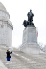 Sergeant Dana Veneskey, from the 338th Army Band, performs taps during the President William McKinley wreath-laying ceremony in Canton, Ohio, Jan. 28, 2017.