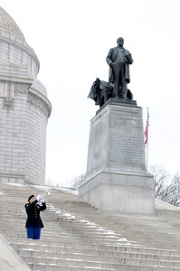 Sergeant Dana Veneskey, from the 338th Army Band, performs taps during the President William McKinley wreath-laying ceremony in Canton, Ohio, Jan. 28, 2017.