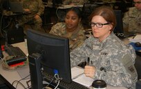 (Left to right) Staff Sgt. Princess Adu and Sgt. Maj. Teresa Beverley go over the rubrics block of instruction as part of the 80th Training Command's first Quality Assurance Officer course at Grand Prairie, Texas, Jan. 24, 2017.