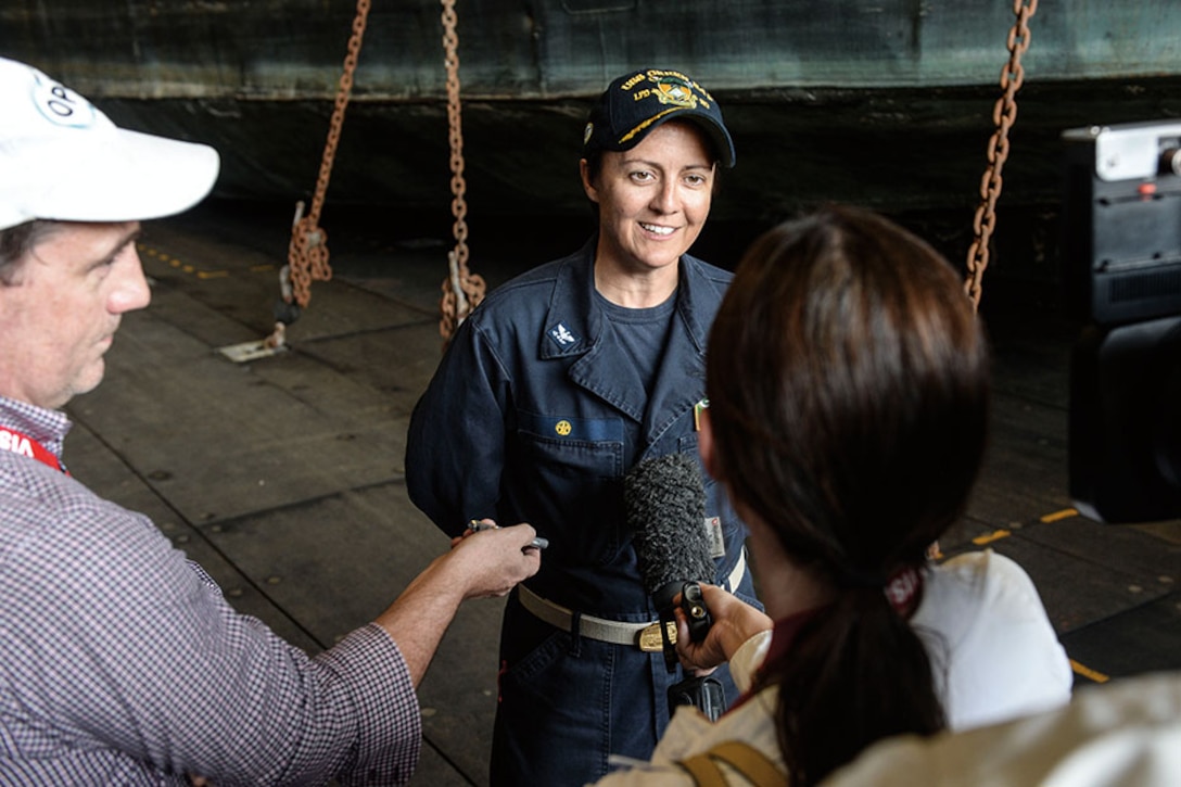 Captain of amphibious transport dock ship USS Green Bay speaks with Australian journalists while participating in Talisman Sabre 2015.