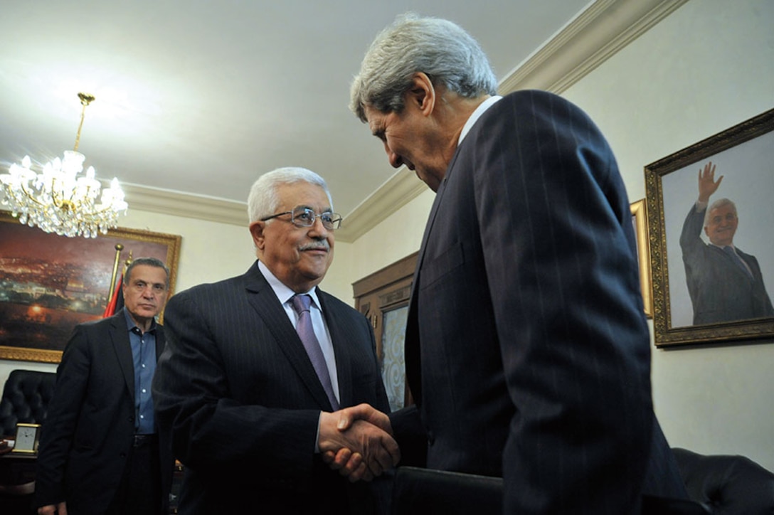 Palestinian Authority President Mahmud Abbas greets U.S. Secretary of State John Kerry as he arrives for meeting in Amman, Jordan, June 2013.