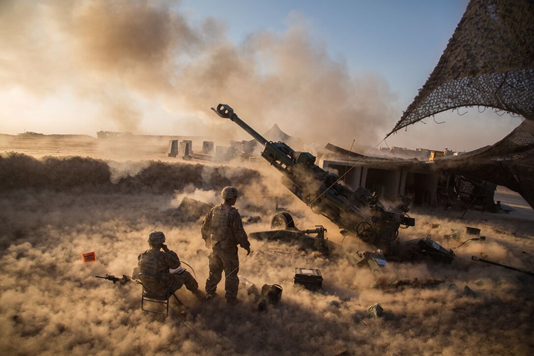 Soldiers assigned to Charlie Battery, 1st Battalion, 320th Field Artillery Regiment, 2nd Brigade Combat Team, 101st Airborne Division, fire M777 A2 Howitzer in support of Operation Inherent Resolve at Platoon Assembly Area 14, Iraq, November 2016.