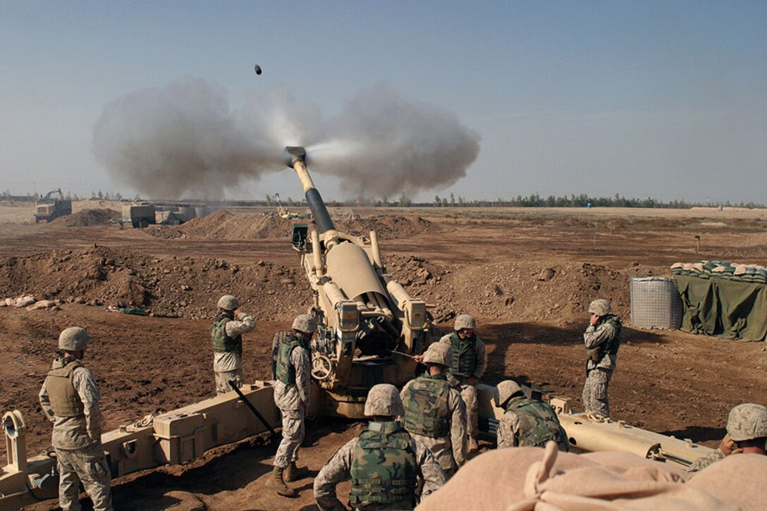 Marines from Mike Battery, 4th Battalion, 14th Marines, operate 155mm M198 howitzer in support of Operation Phantom Fury, November 2004.