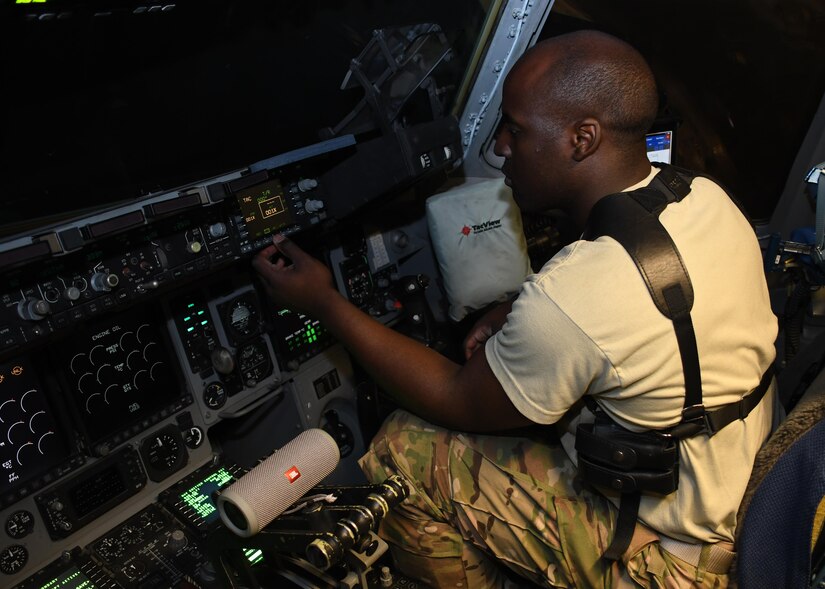 U.S. Air Force 1st Lt. Wesley Cobb, a pilot with the 816th Expeditionary Airlift Squadron, performs preflight checks on a C-17 Globemaster III at Al Udeid Air Base, Qatar, Dec. 23, 2016. The C-17 is capable of rapid strategic delivery of troops and of cargo to main operating bases or directly to forward operating bases in the U.S. Central Command area of responsibility. (U.S. Air Force photo by Senior Airman Miles Wilson)