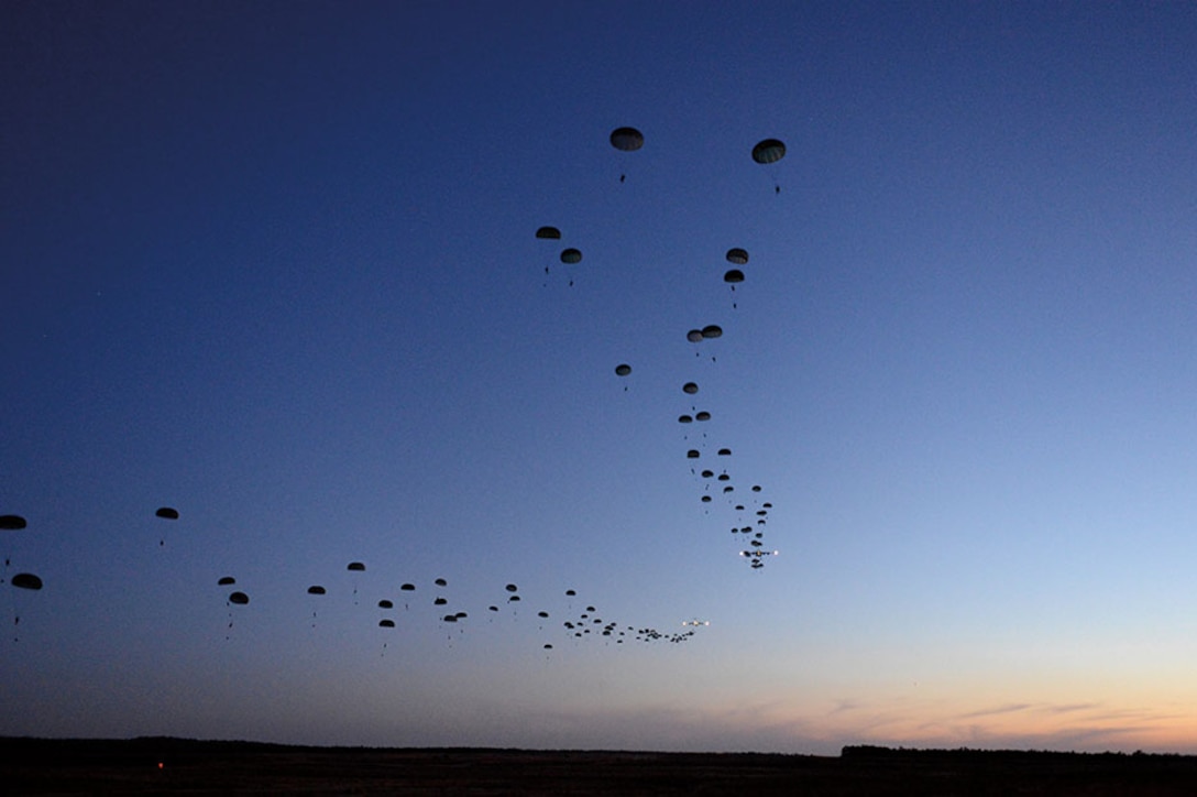 Soldiers conduct static line airdrop during Joint Operational Access Exercise 13-02, at Sicily drop zone, Fort Bragg, North Carolina, to train with paratroopers from U.S. Army’s 82nd Airborne Division on projecting combat power in denied environments (DOD/Jason Robertson)