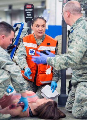 Service members from David Grant USAF Medical Center participate in an active shooter exercise at Travis Air Force Base, Calif., Jan. 26, 2017. The exercise evaluated the medical staff’s lock down response and patient care procedures. (U.S. Air Force photo/Louis Briscese)