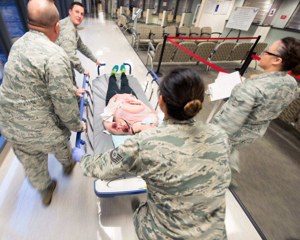 Service members from David Grant USAF Medical Center participate in an active shooter exercise at Travis Air Force Base, Calif., Jan. 26, 2017. The exercise evaluated the medical staff’s lock down response and patient care procedures. (U.S. Air Force photo/Louis Briscese)