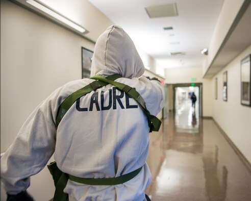 Service members from David Grant USAF Medical Center participate in an active shooter exercise at Travis Air Force Base, Calif., Jan. 26, 2017. The exercise evaluated the medical staff’s lock down response and patient care procedures. (U.S. Air Force photo/Louis Briscese)