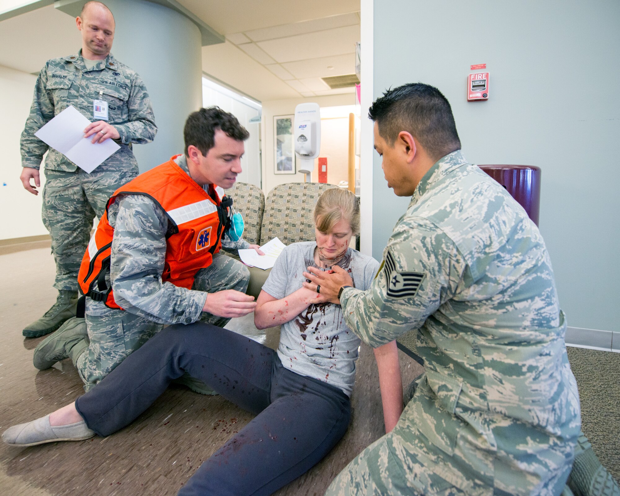 Service members from David Grant USAF Medical Center participate in an active shooter exercise at Travis Air Force Base, Calif., Jan. 26, 2017. The exercise evaluated the medical staff’s lock down response and patient care procedures. (U.S. Air Force photo/Louis Briscese)