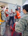 Service members from David Grant USAF Medical Center participate in an active shooter exercise at Travis Air Force Base, Calif., Jan. 26, 2017. The exercise evaluated the medical staff’s lock down response and patient care procedures. (U.S. Air Force photo/Louis Briscese)