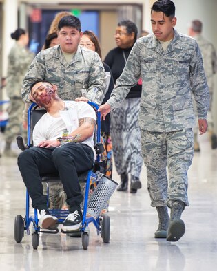 Service members from David Grant USAF Medical Center participate in an active shooter exercise at Travis Air Force Base, Calif., Jan. 26, 2017. The exercise evaluated the medical staff’s lock down response and patient care procedures. (U.S. Air Force photo/Louis Briscese)