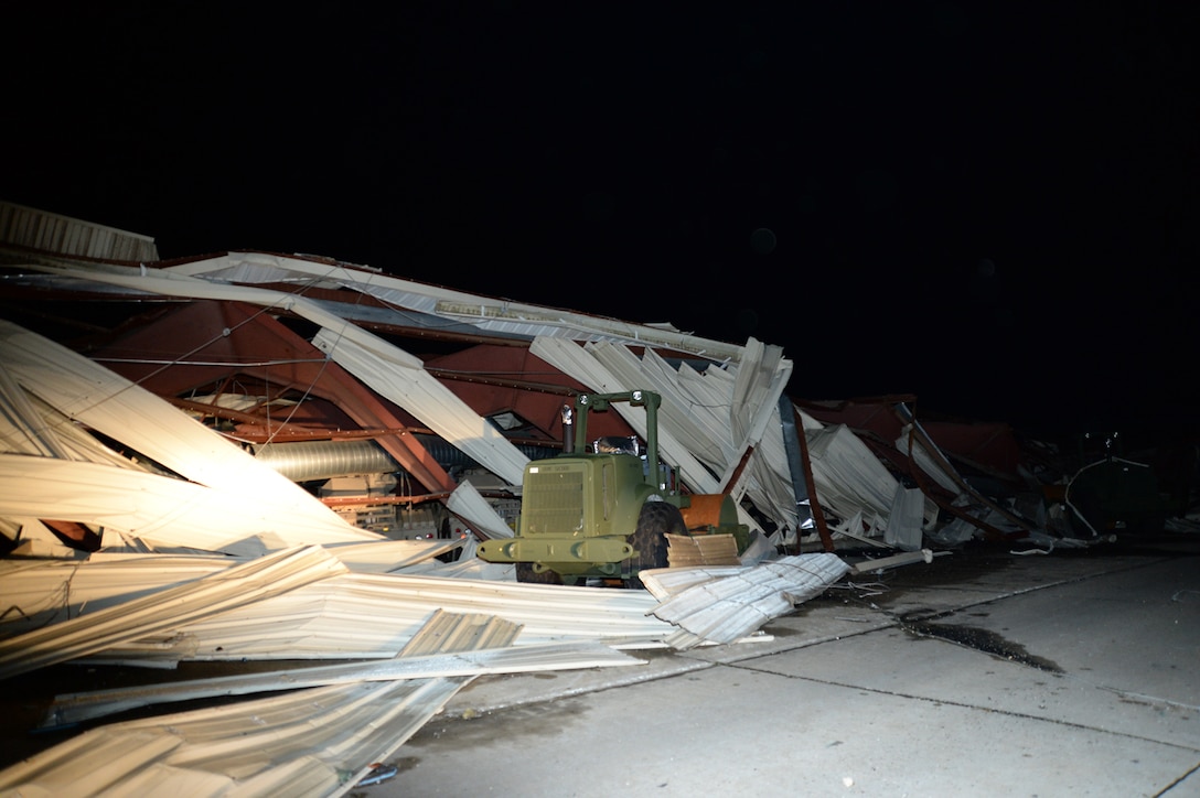 An EF-3 tornado destroys a structure aboard Marine Corps Logistics Base Albany, Jan. 22.  The tornado passed through the Albany, Georgia, community and the installation carving a path of destruction leaving the landscape strewn with broken trees, downed power lines and damaged structures and military vehicles, Jan. 22.