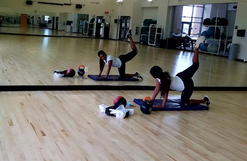 U. S. Air Force Airman 1st Class Chelsi Knott, 633rd Force Support Squadron services apprentice, exercises in the Shellbank Fitness Center’s multipurpose exercise room at Joint Base Langley Eustis, Va., Jan. 23, 2017. After being closed for almost eight months due to a pipe leak, the room has reopened with new flooring and will host fitness classes including yoga, step aerobics, Zumba, stretch and tone and body sculpting. (U.S. Air Force photo by Beverly Joyner)