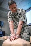 Maj. Eric Hoopes, commander of the 149th Fighter Wing’s Detachment 1, Texas Air National Guard, counts out compressions during a basic life support class at the 149th Medical Group, headquartered at Joint Base San Antonio, Texas, Nov. 30, 2016. Hoopes was instrumental in saving the life of a child who had nearly drowned to death at a local area pool. 