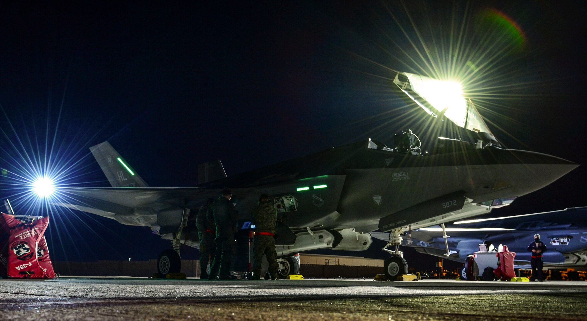 Maintainers from the 419th and 388th Fighter Wings, Hill Air Force Base, Utah, conduct preflight checks on an F-35A Lightning II from Hill Air Force Base, Utah, during Red Flag 17-1 at Nellis Air Force Base, Nev., Jan. 24, 2017. The F-35’s multi-role capabilities allows it to perform missions which traditionally required numerous specialized aircraft. (U.S. Air Force photo by Airman 1st Class Nathan Byrnes/Released)